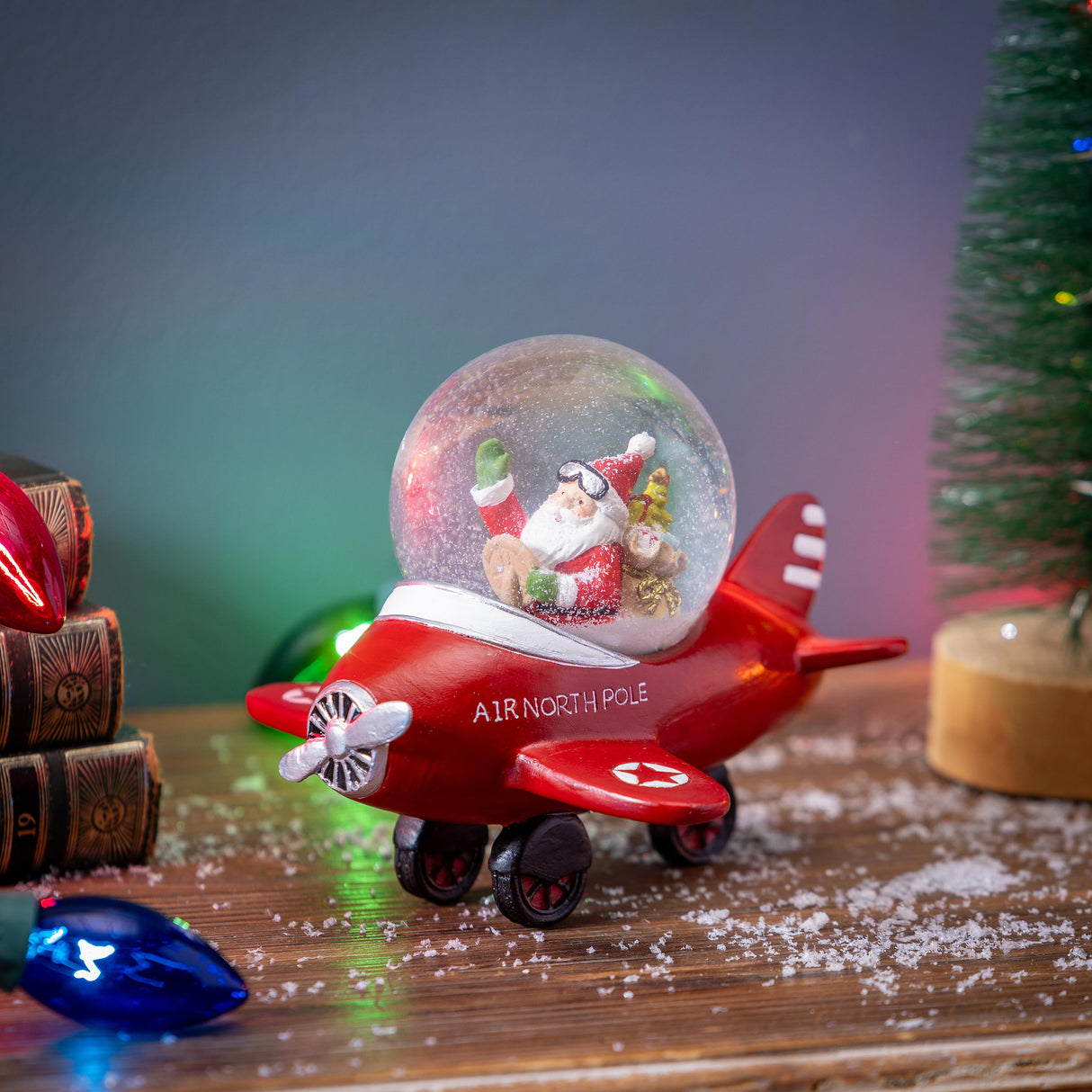 Christmas Vacation Water Globe Santa in Plane Resin