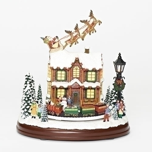 #J -9.25"H LIGHTED MUSICAL SANTA OVER HOUSE AND ROTATING TRAIN -USB ADAPTOR